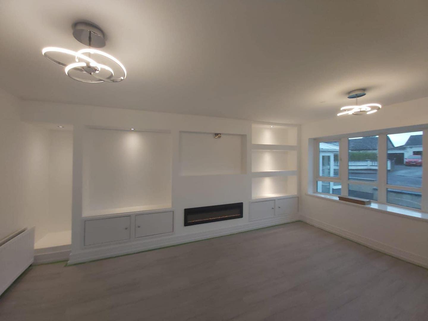 Lighting on media wall in County Antrim home.