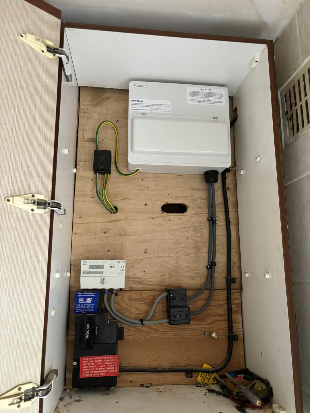 Metal fuse box installed in the cupboard in Carrickfergus, County Antrim